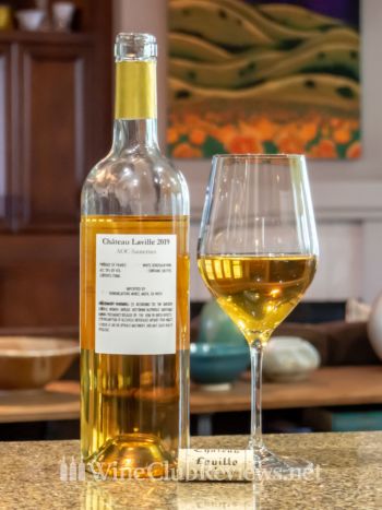 Château Laville Sauternes: front of bottle with wine in glass