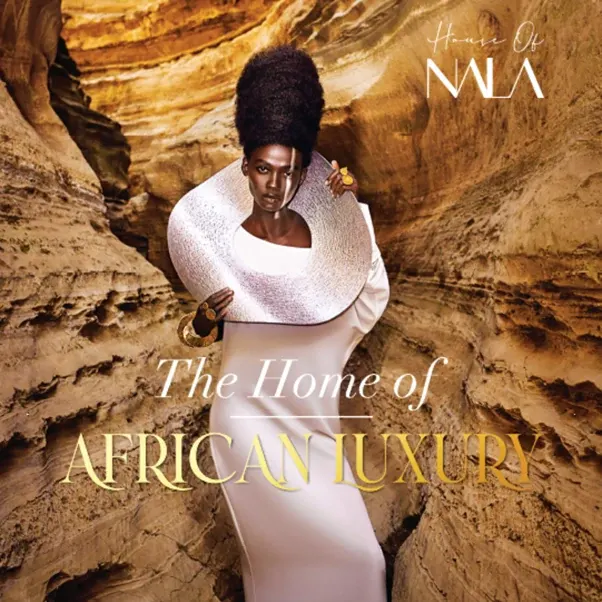 Graphic of an African model in caves wearing a white dress and a brass neckpiece.