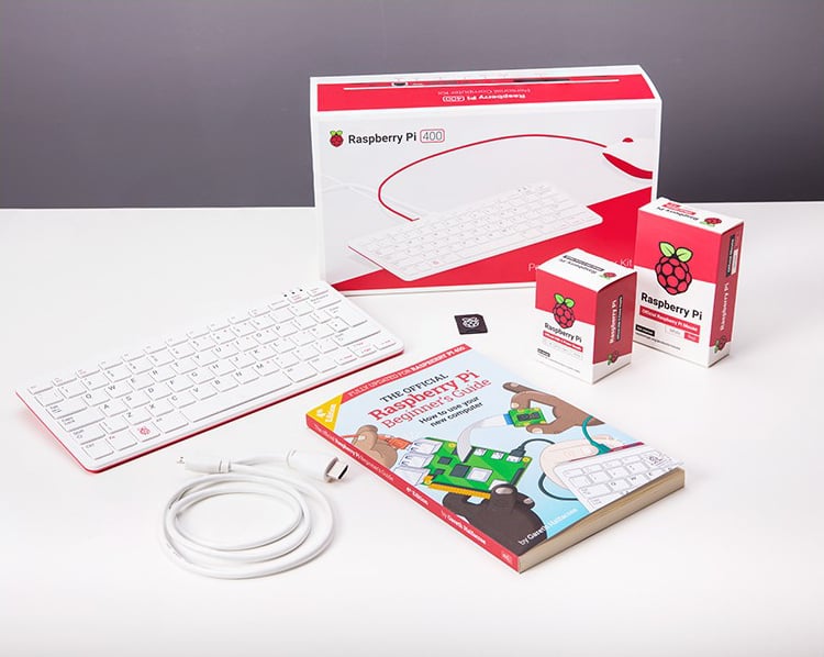 Kit Raspberry Pi 400 - Un computer integrato in una tastiera compatta ed un manuale d'uso.