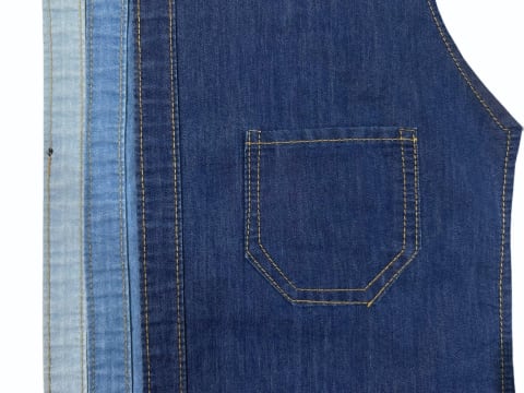 5.25 oz Indigo Blue cotton polyester twill denim fabric with soft mercerized finish, 178 GSM and 65 inch width, available in Kolkata