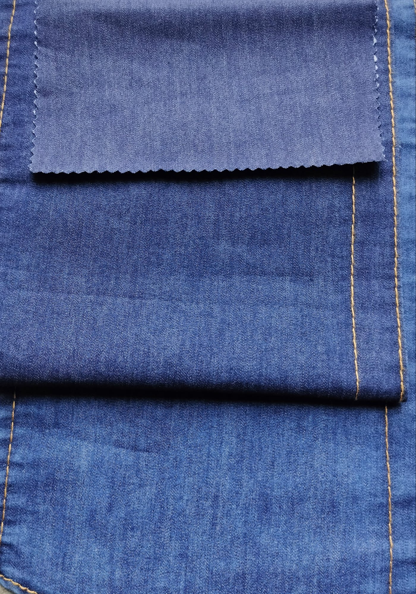 Soft finished cotton poly denim fabric, 178 GSM twill structure for bulk garment production