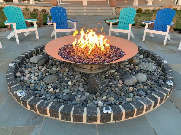 Custom Firepit Surrounded with Beach Pebbles and Belgian Block