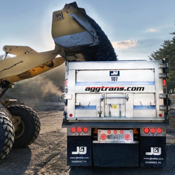 Aggtrans dump truck being loaded with materials