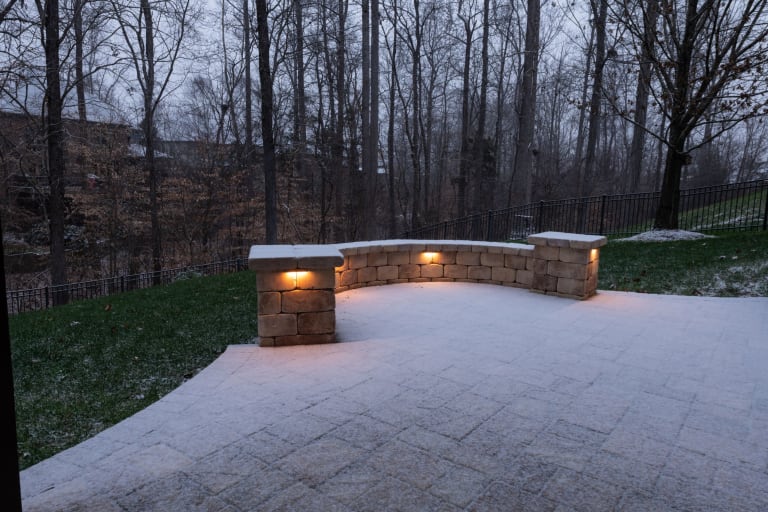 Taking a few preventative steps before temperatures drop can help extend the life and appearance of your outdoor spaces. Paver Patio with Snow