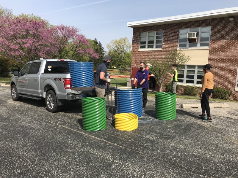 Volunteers loading a pickup truck with materials