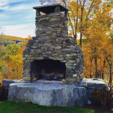 Outdoor Fireplace Mounted on Boulder