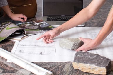 Helping customers select the right products for their project during an in-person consultation at The Stone Store in Harmans, MD