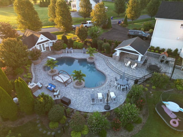 From Deck to Dream Patio: Comparing Pavers vs Natural Stone vs Concrete Slabs Dream Patio by Continental Landscaping