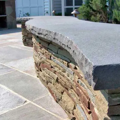 Bluestone Radius Tread on Stacked Stone Wall Bluestone Radius Tread on Stacked Stone Wall