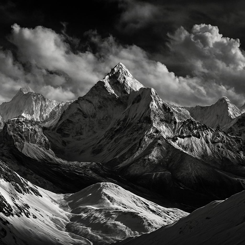Himalayan peaks with dramatic clouds and snow ridges