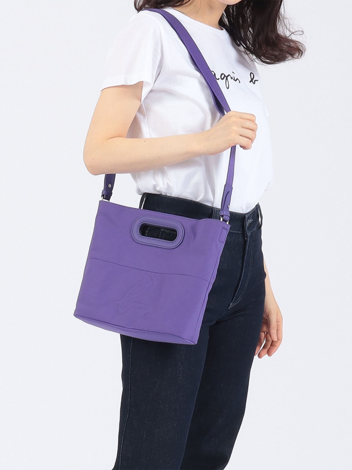 purple shoulder bag with "b." logo