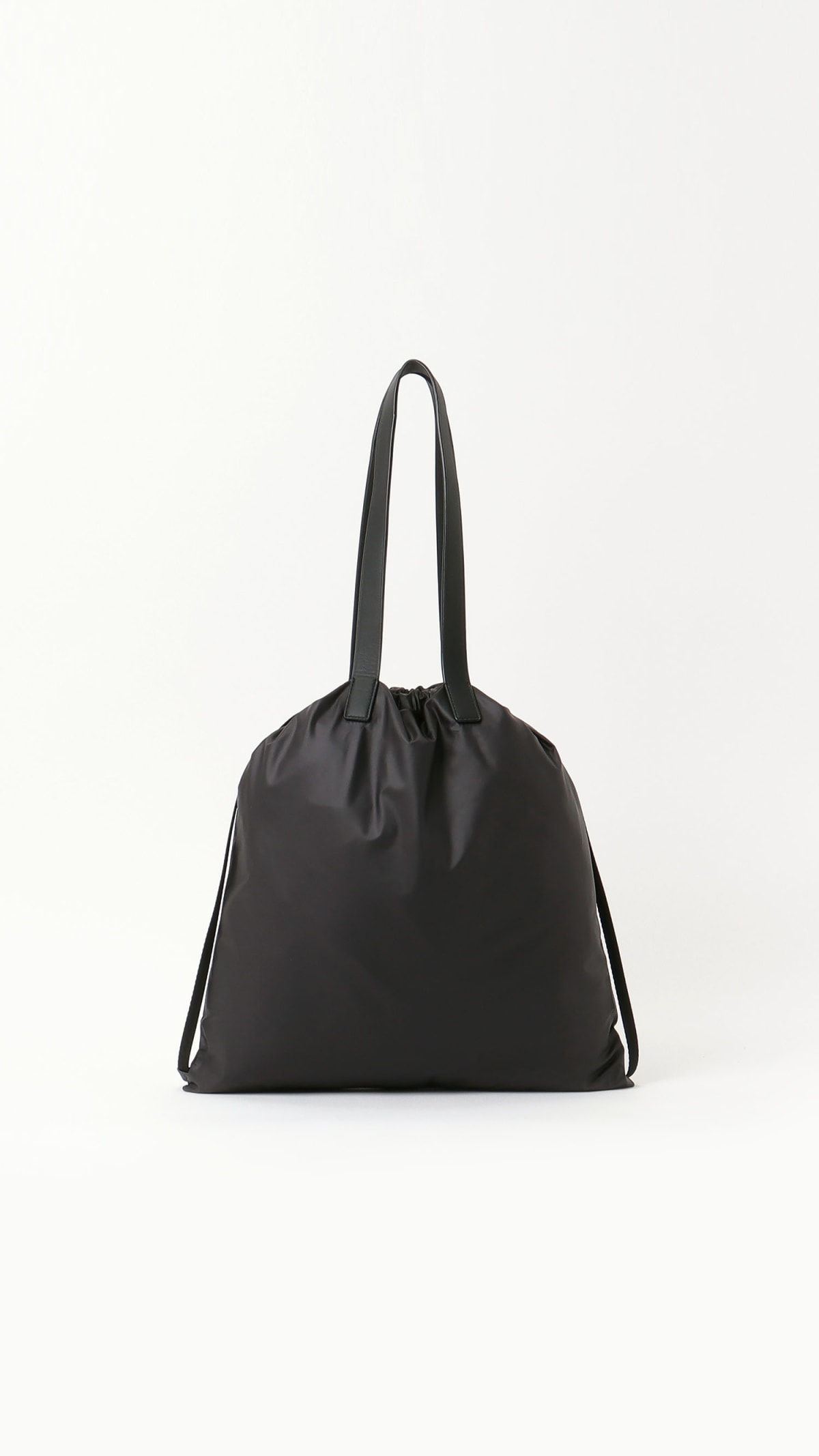 black nylon bag with leather handles