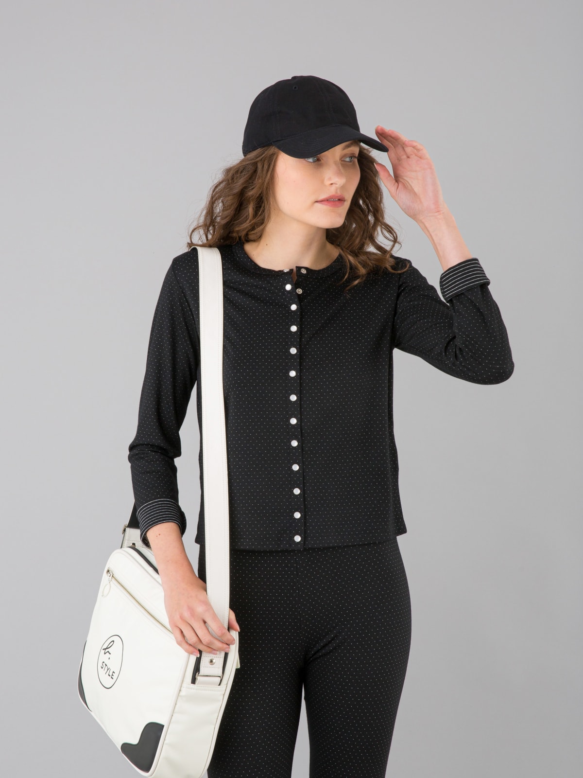 black jersey snap cardigan with white polka dots