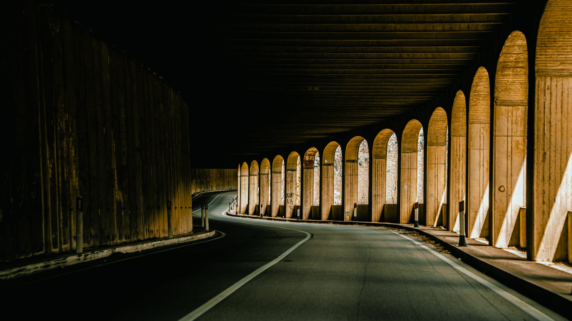 Road through arched tunnel