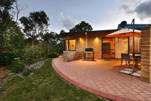 Lovely paved patio with bbq, umbrella, table and chairs.