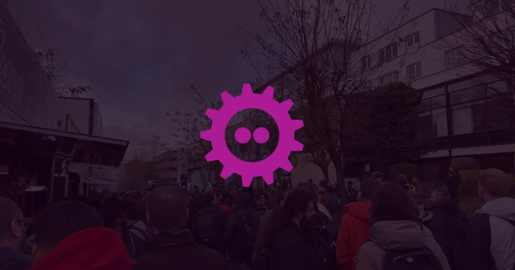 FOSDEM logo on an image of people from the conference outdoors