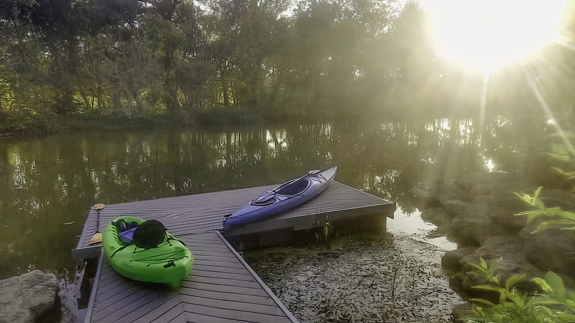 Kayaks ready to set out on the Trinity River during sunrise