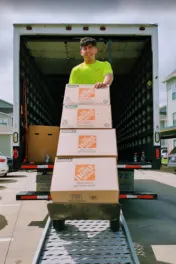 Rolling moving boxes off a moving truck in Fort Worth, Texas