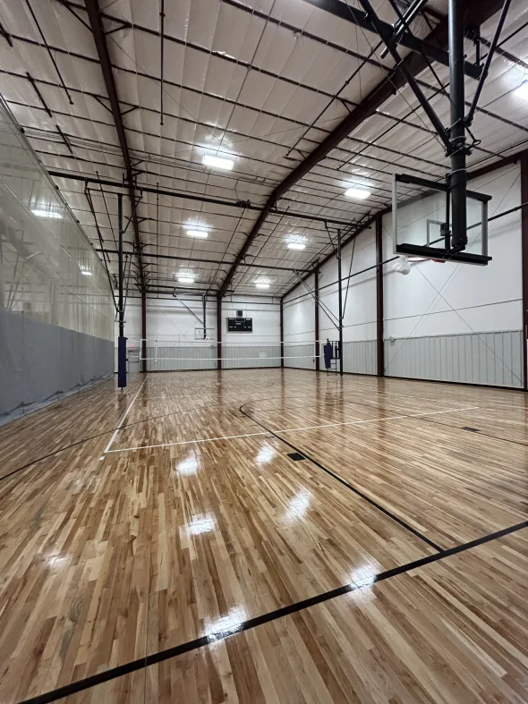 Indoor basketball and volleyball courts at IMPACT Center