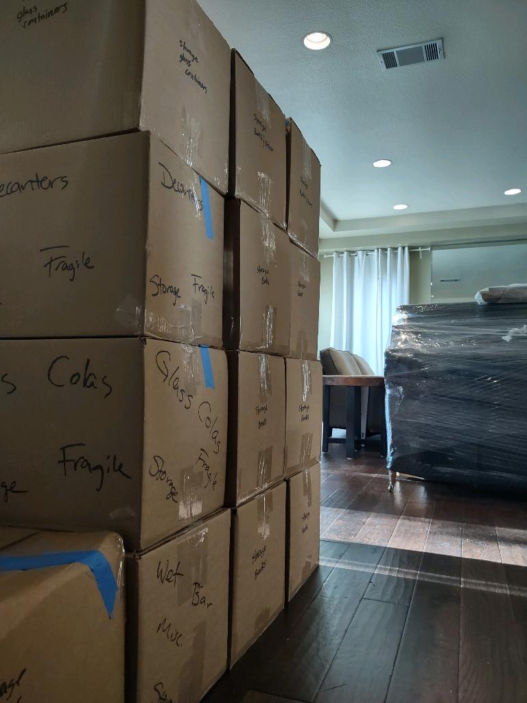 Fragile items and glassware packed and stacked neatly for your next move