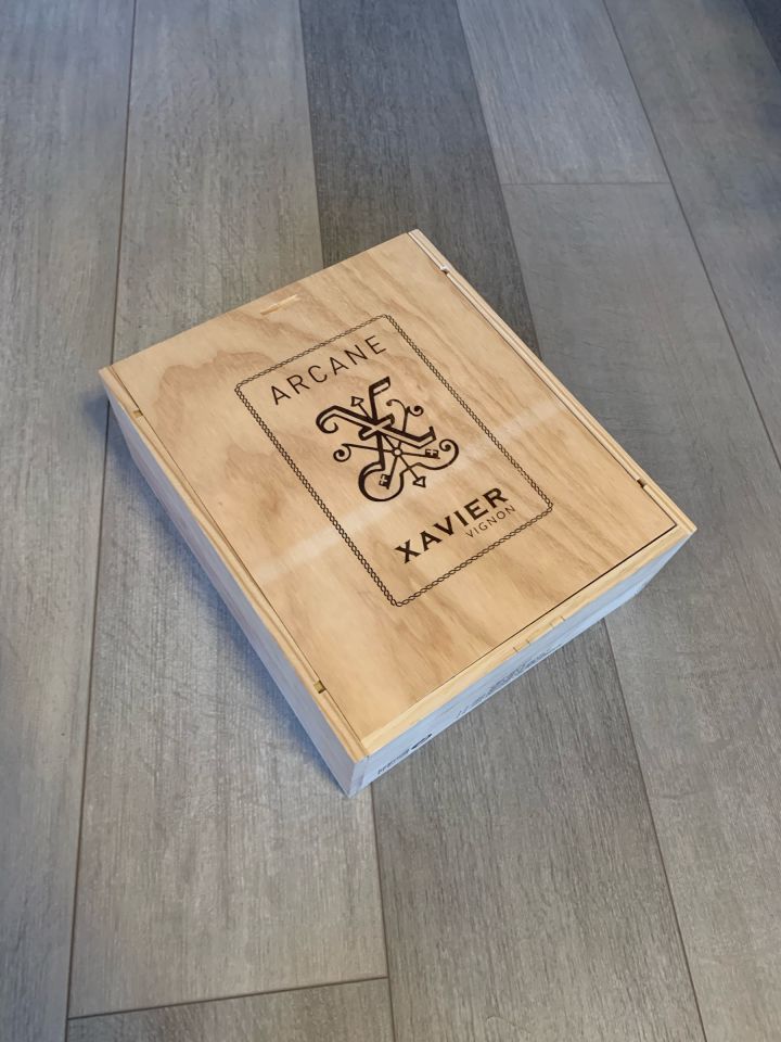 A wooden crate that can holds three bottles of wine