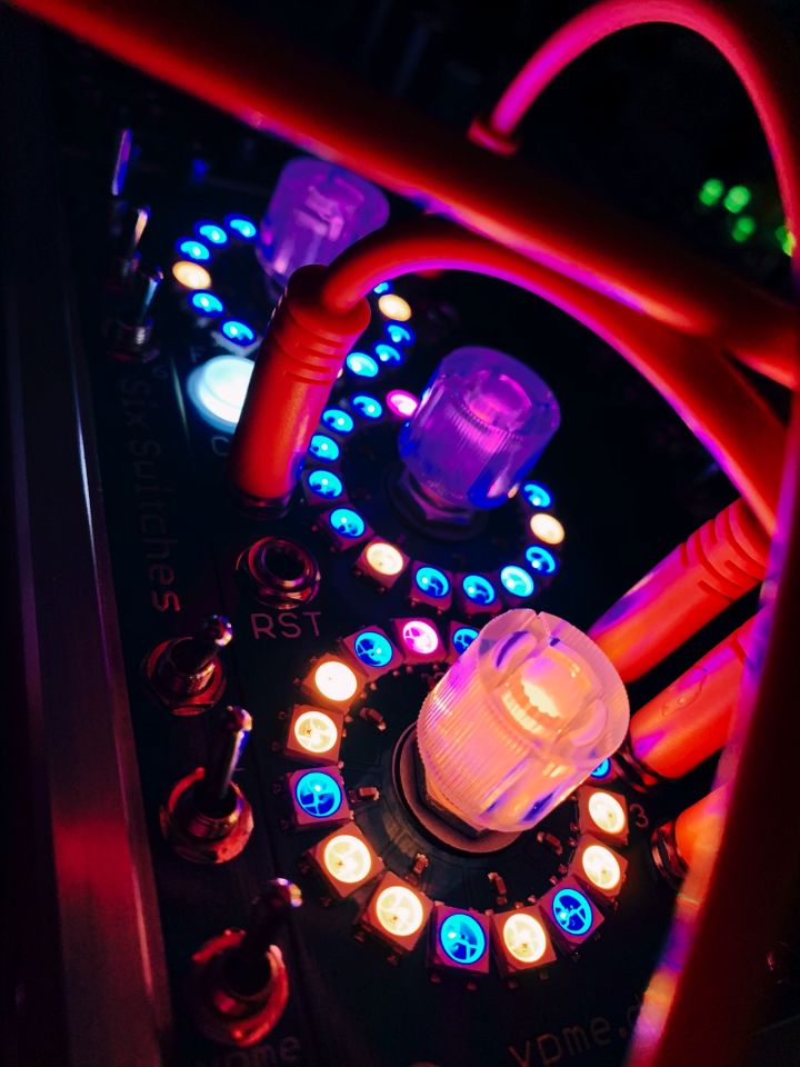 The Euclidean Cirlces V2 eurorack module in the dark. The LED lights are georgous.