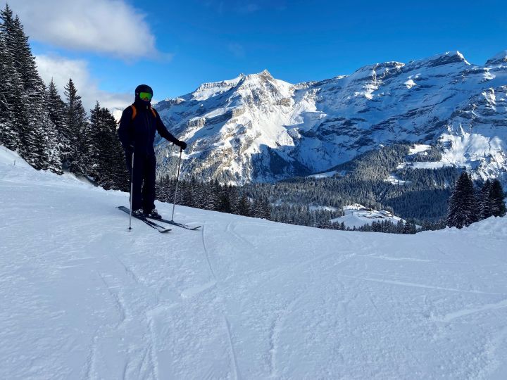 Cédric in ski gear with the Diablerets massif in the background