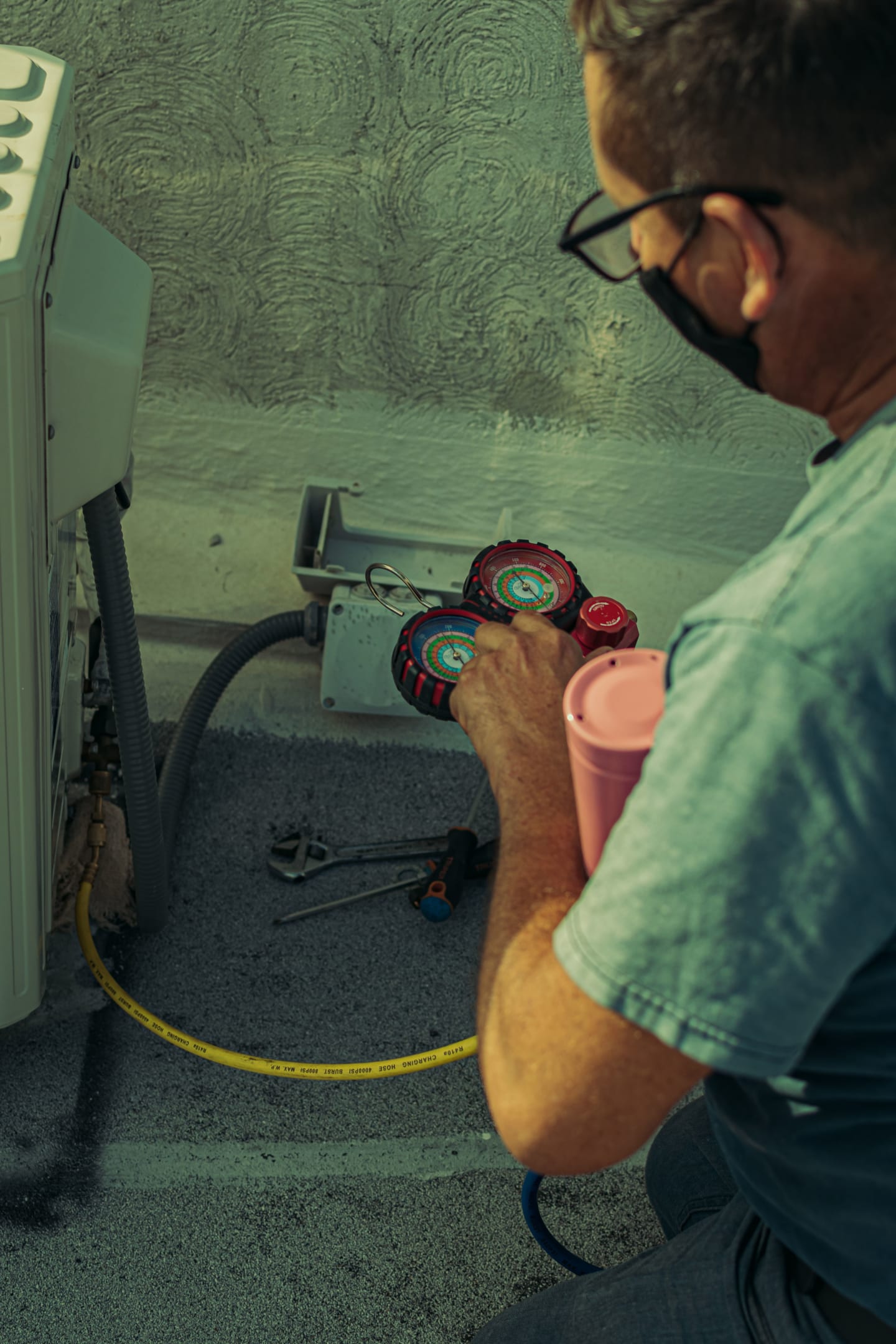 HVAC technician servicing an air-conditioning system