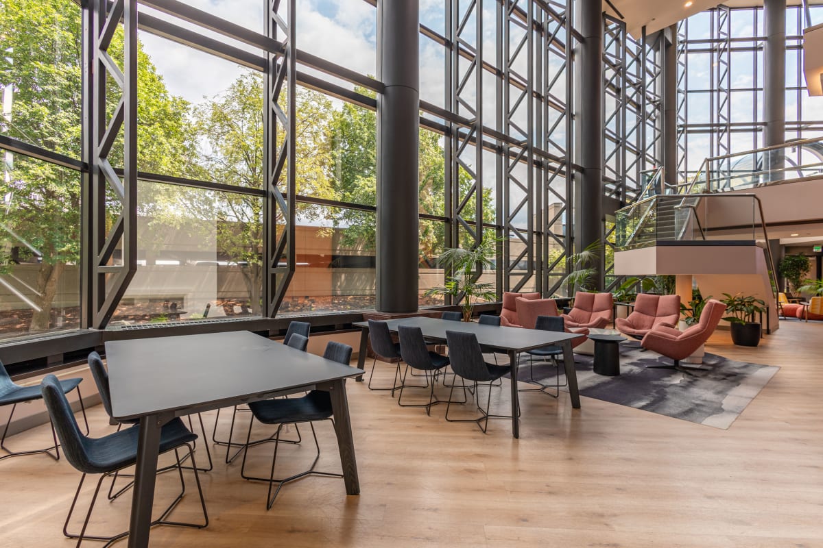 Open lounge with tall windows at an Alliance business center