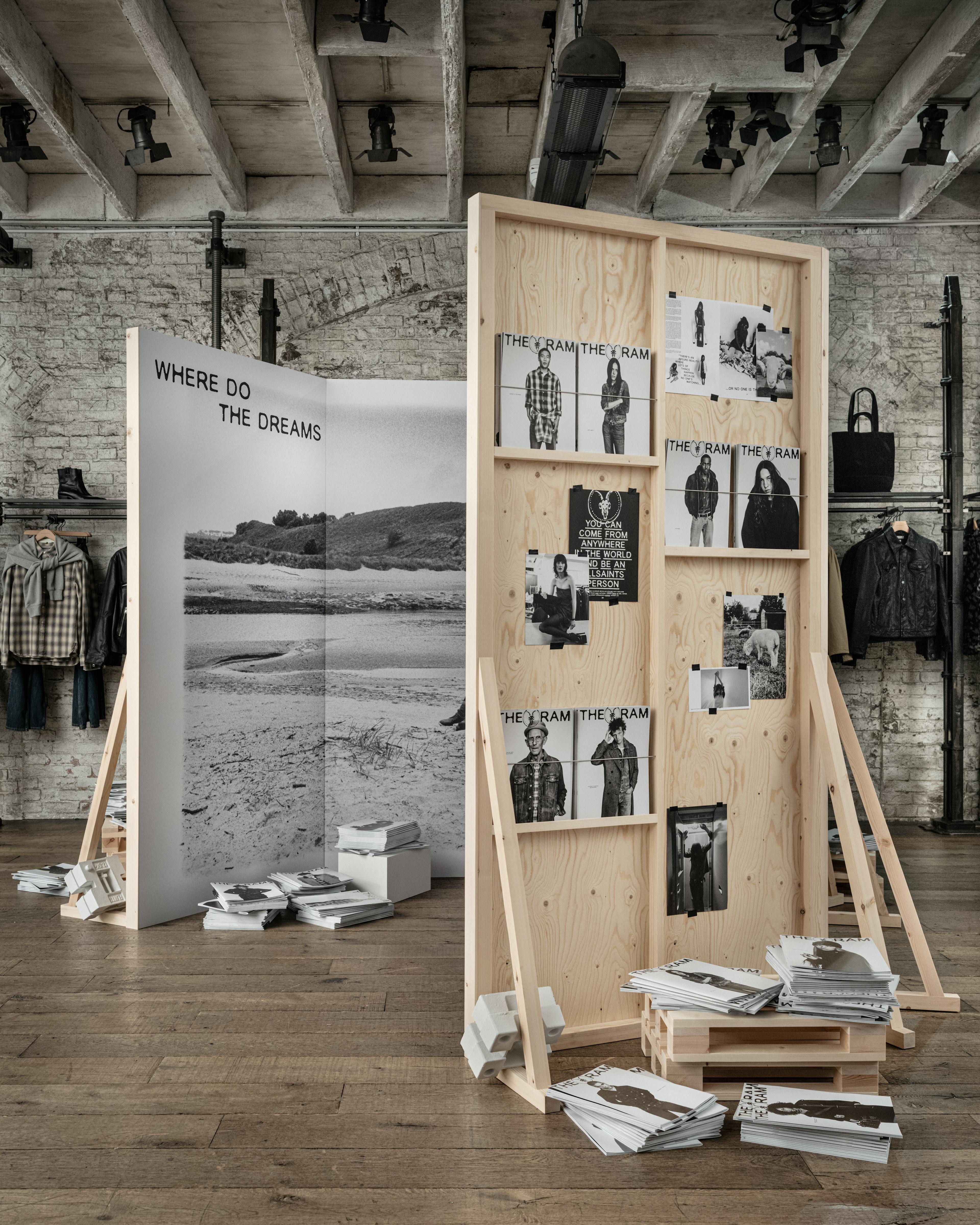 A photograph showing an installation displaying the THE REAM zines in an industrial shop