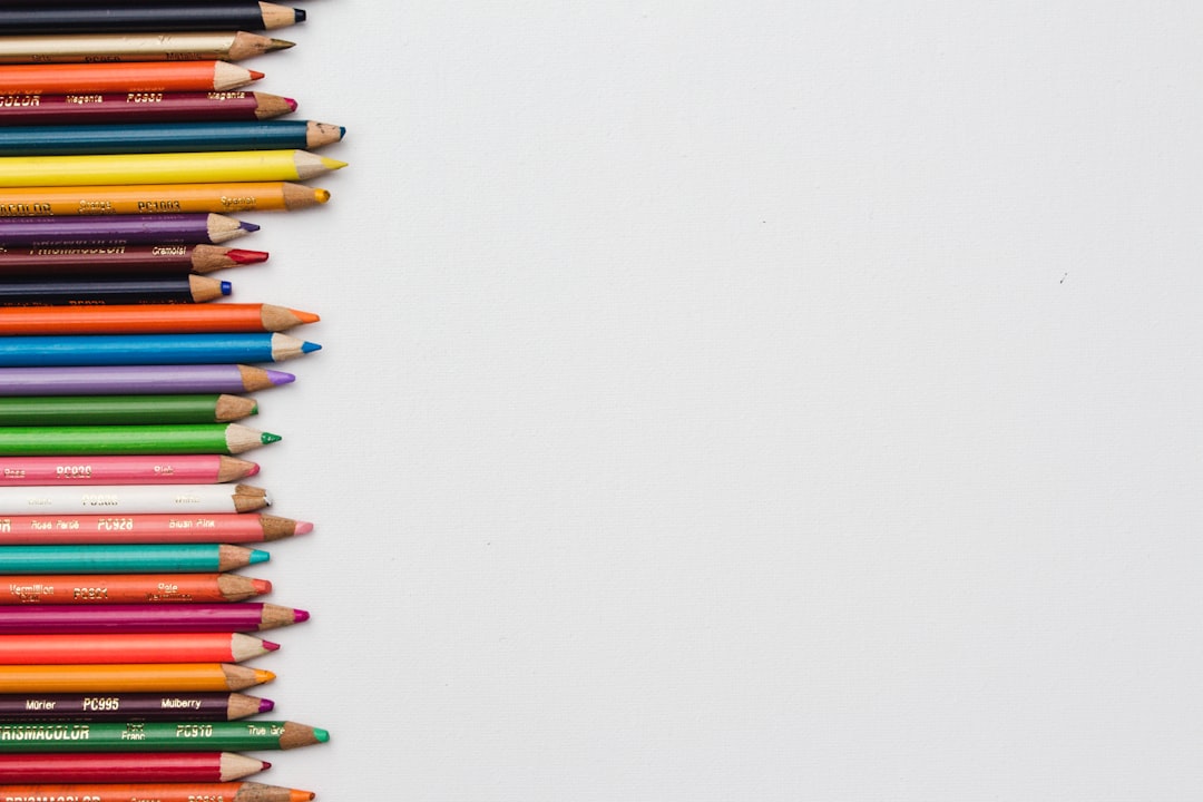 A row of multi coloured pencils