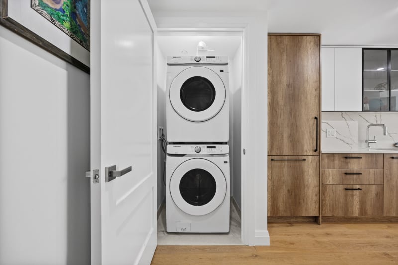 In-unit Samsung washer and dryer in modern laundry closet