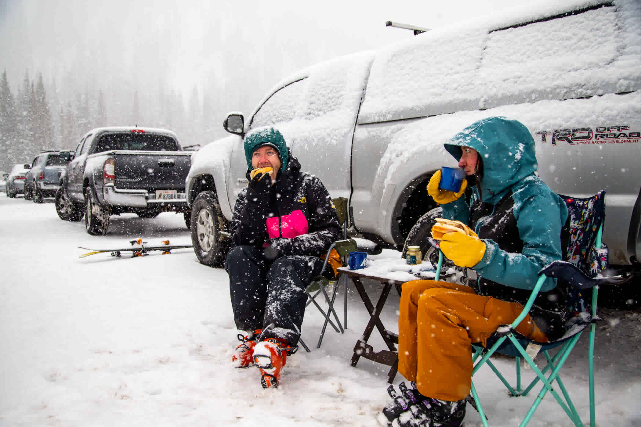 Alta skiers enjoy a quick lunch break at their vehicle in the Wildcat lot