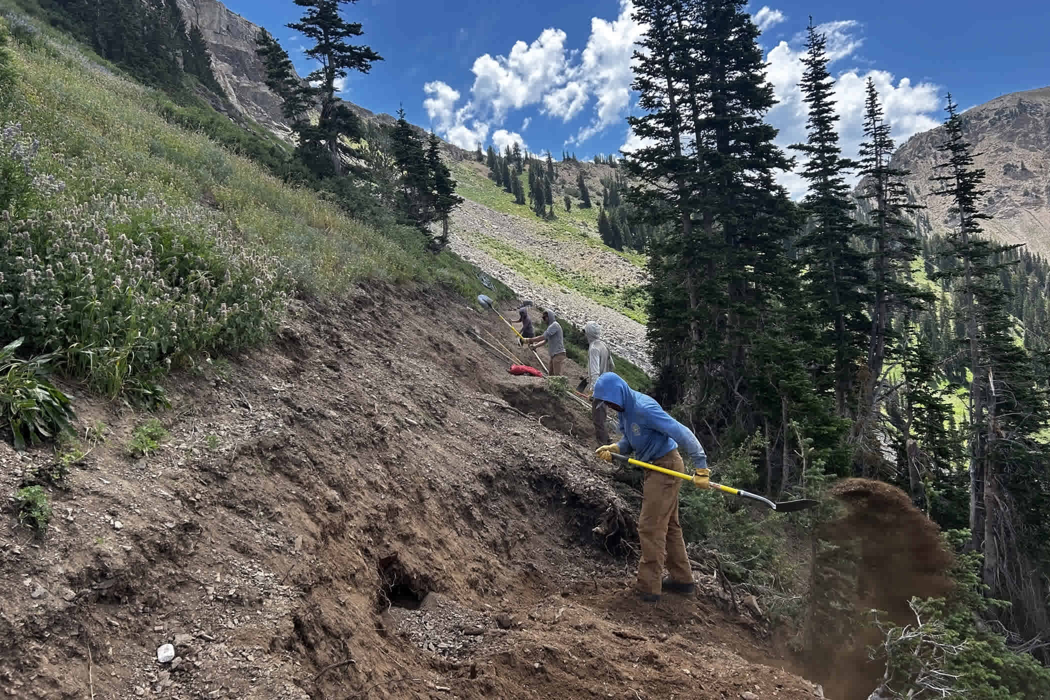 July 29th: Hand cutting the High Traverse | Photo: Duke Grewe
