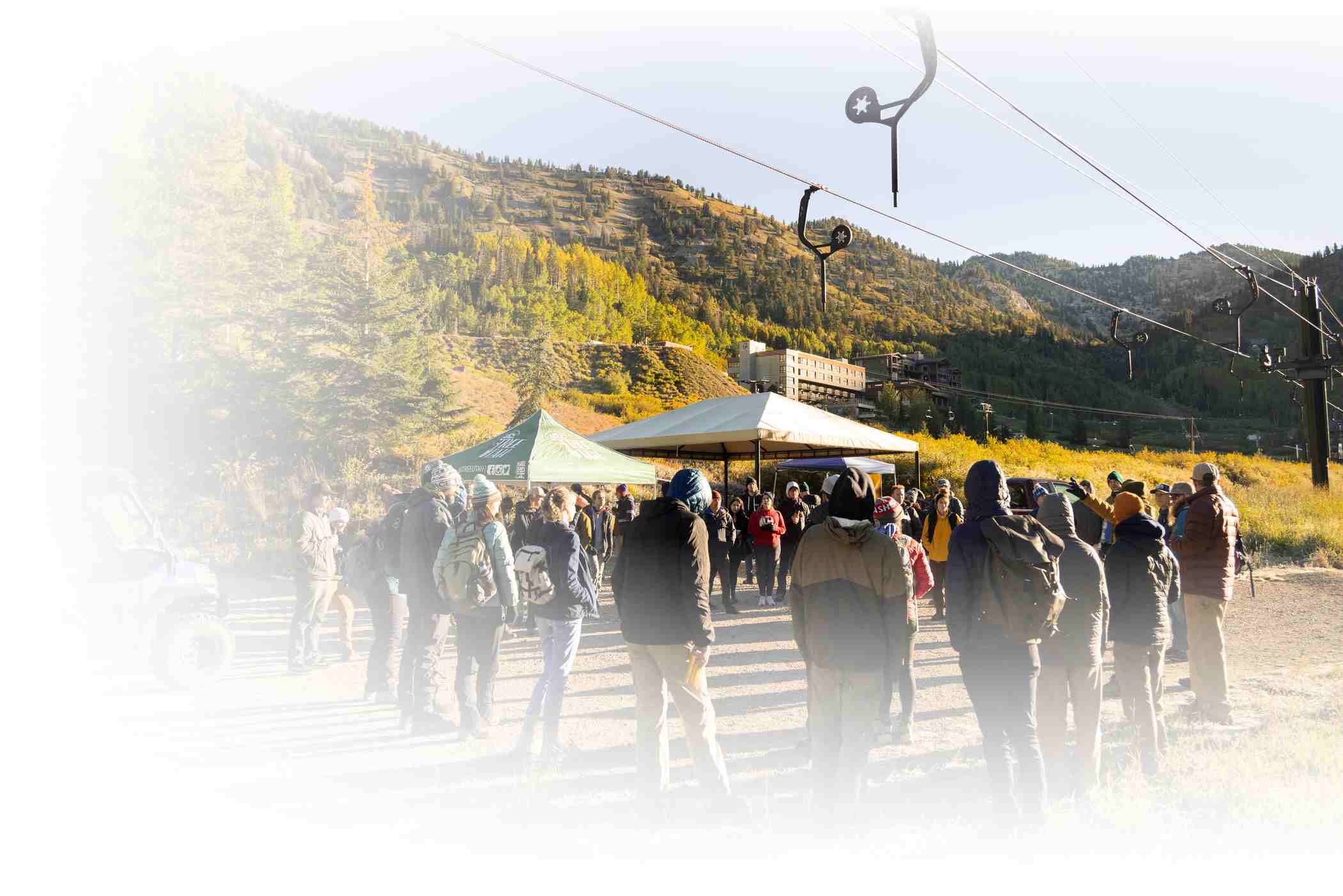 Volunteers work to clean up Alta Ski Area on a sunny summer day