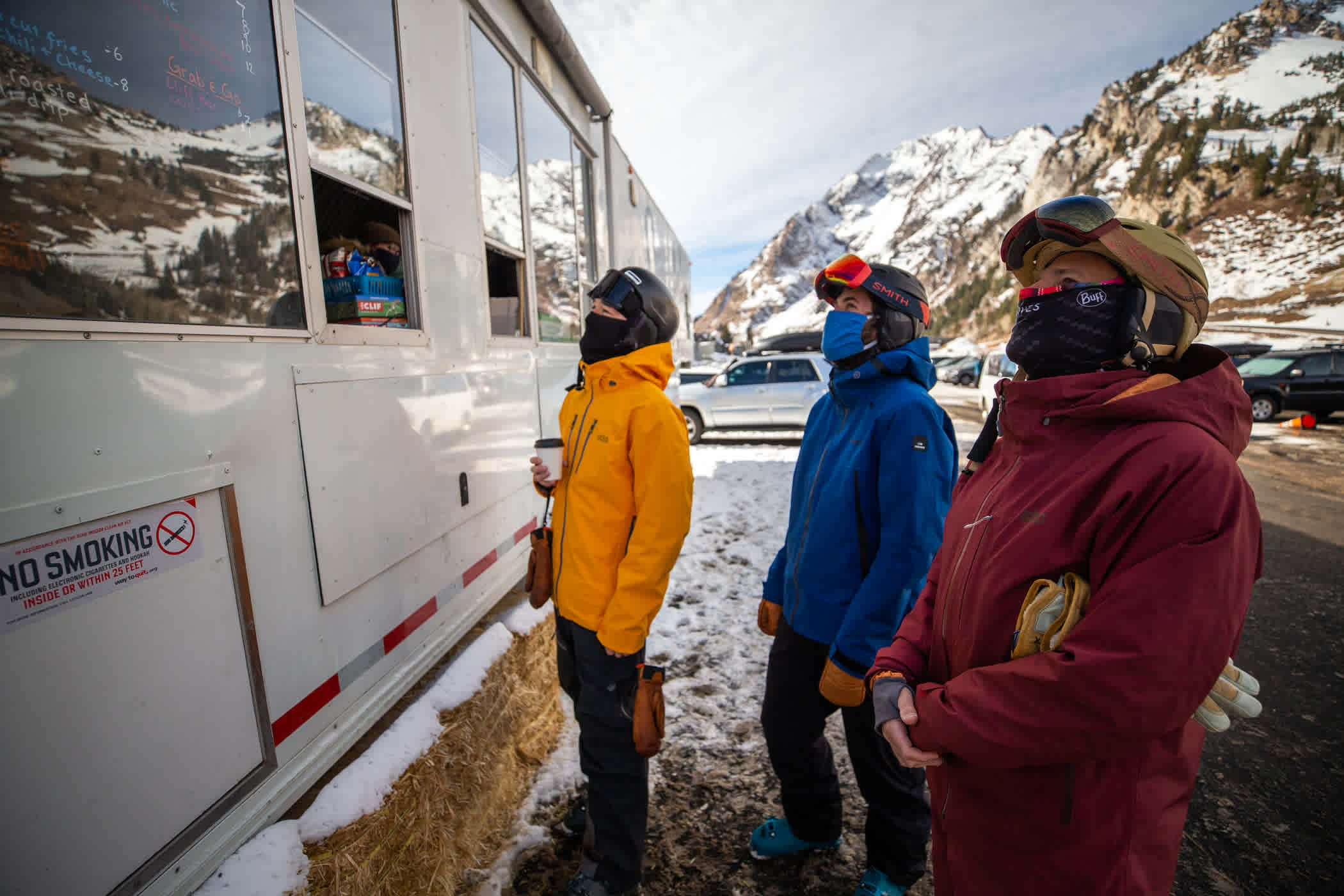 Skiers wait for grab-and-go food at the Base Camp Kitchen in the Wildcat lot