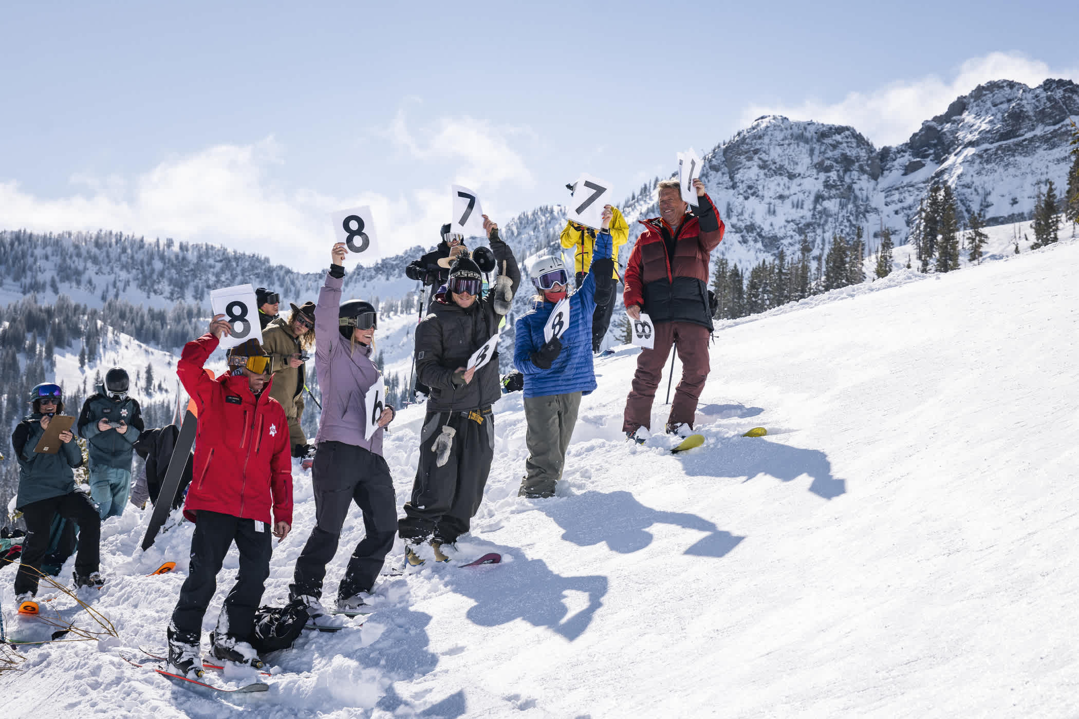 Judges hold numerical scorecards for Alta's Powder 8s Competition