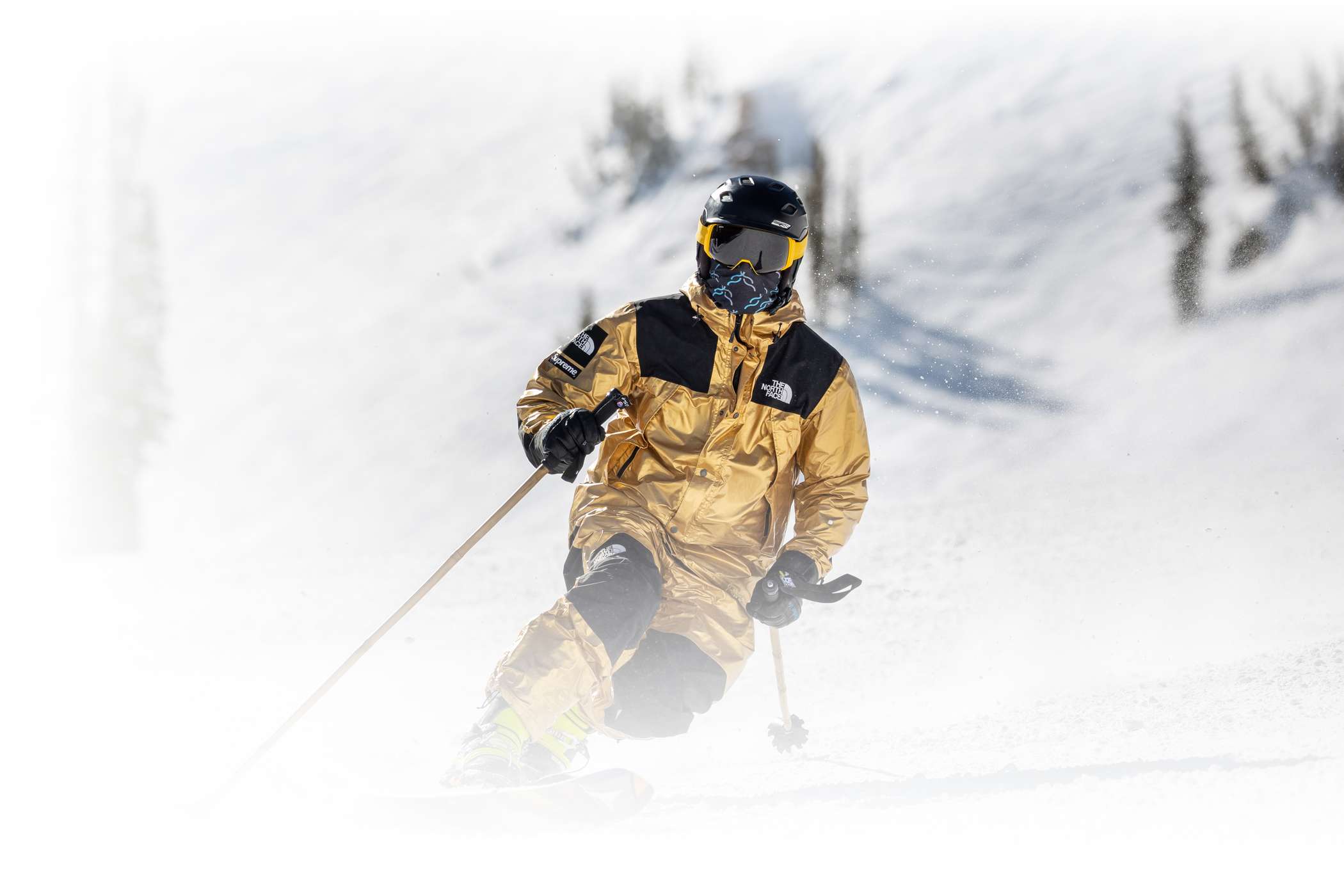 a telemark skier in a golden suit enjoys a sunny spring day at Alta Ski Area