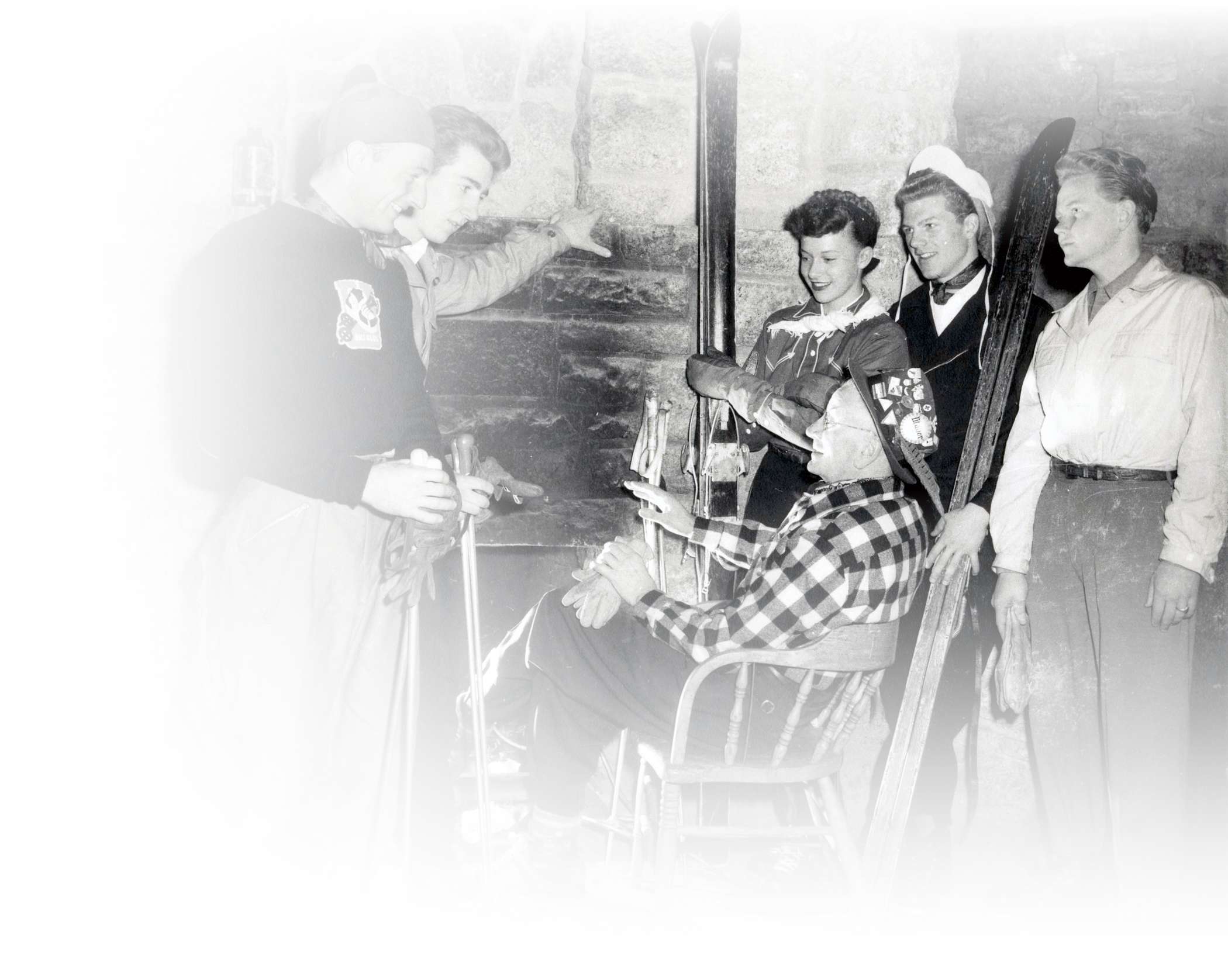 Mayor George Watson brags about his ski history to friends around the fireplace