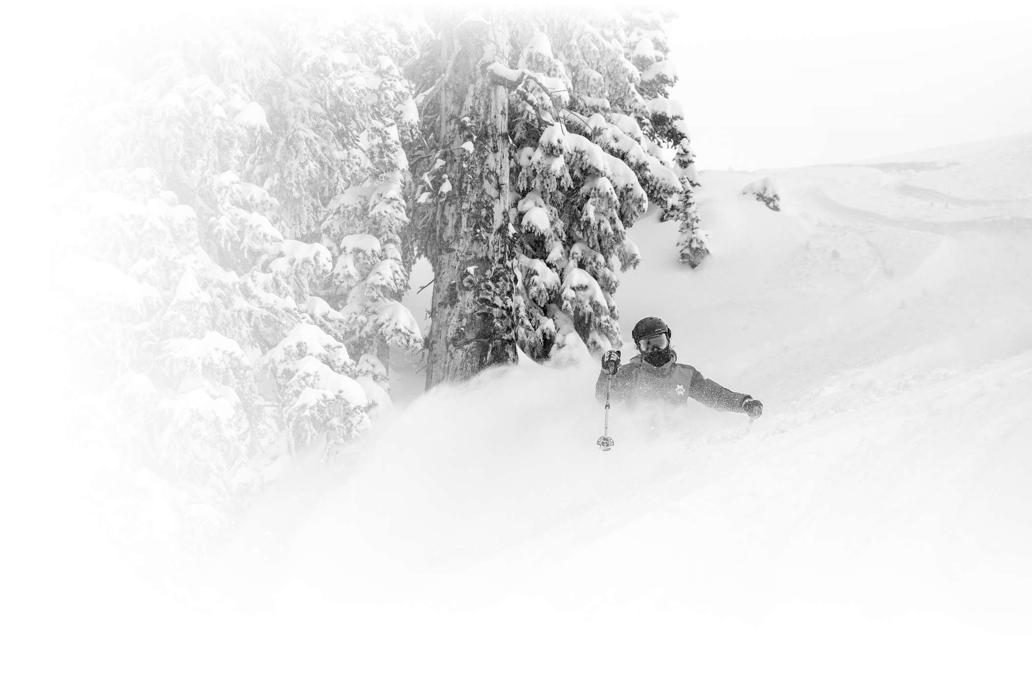 An Alta Ski Area employee helps two skiers load the Wildcat chair