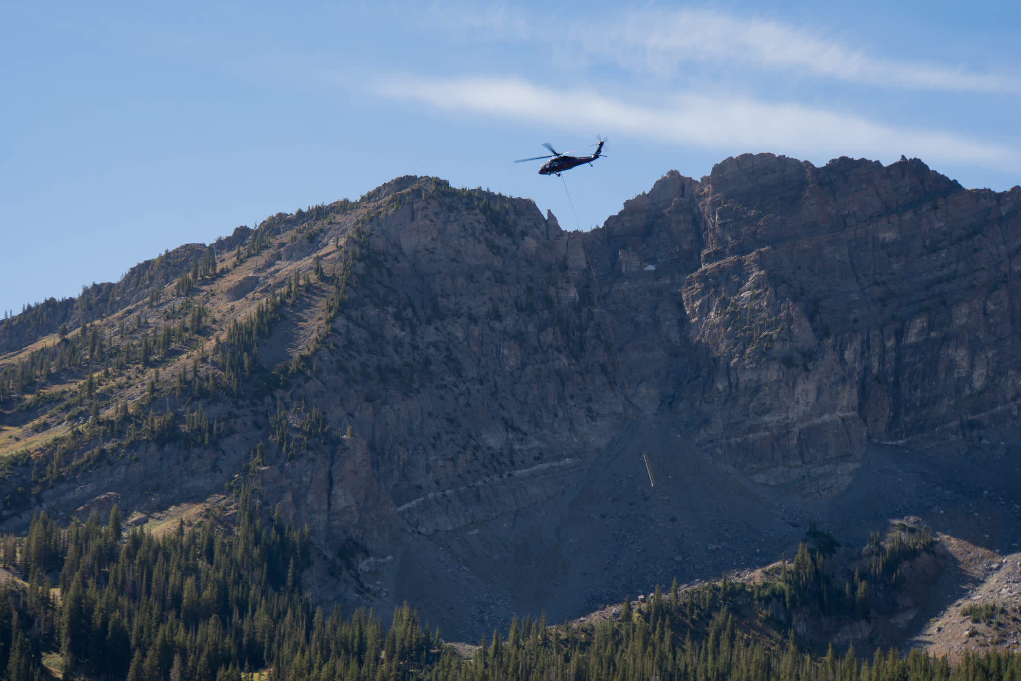 September 10th: A BlackHawk helicopter hoists a Supreme lift tower | Photo: Adam Fehr