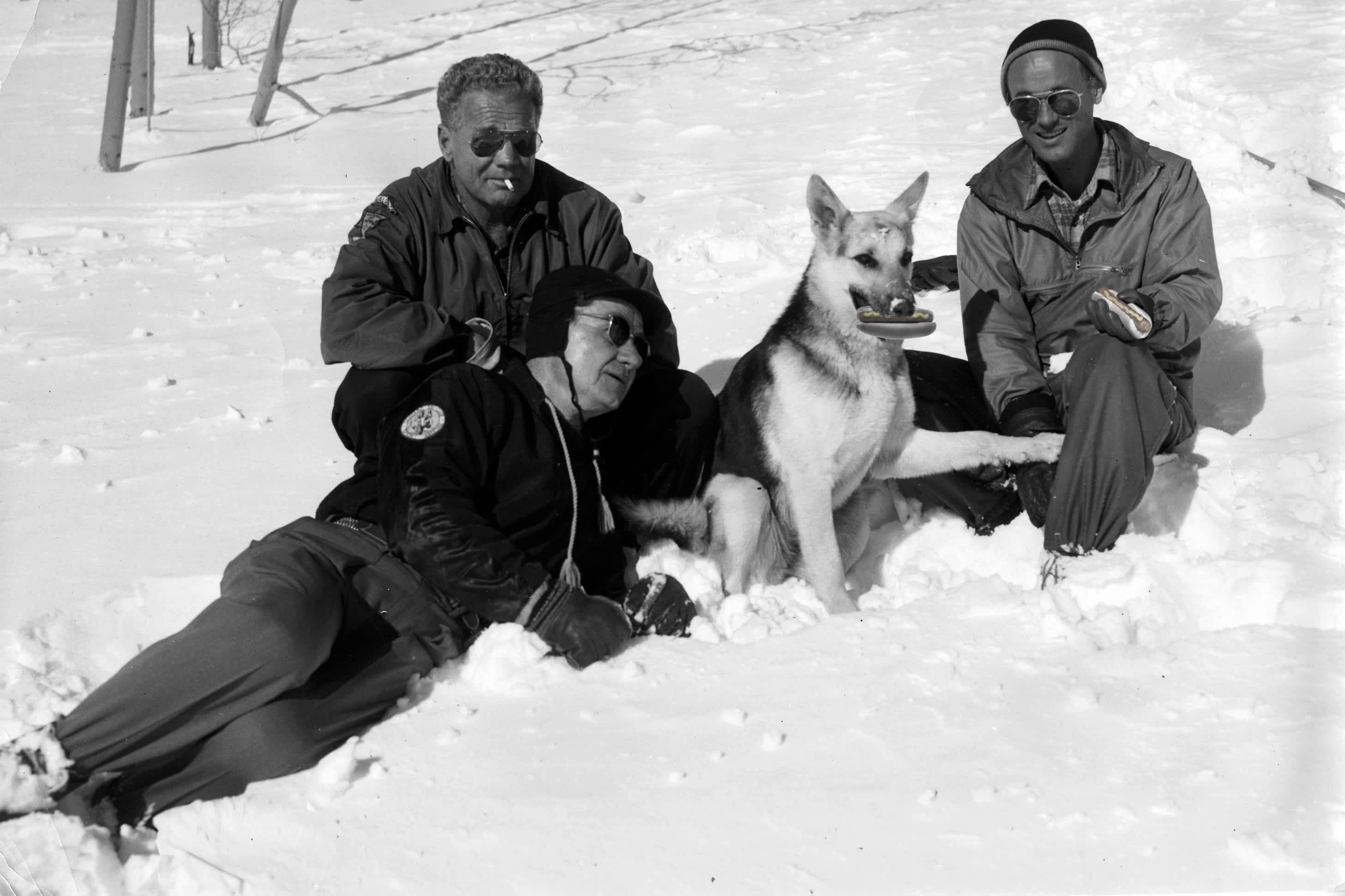 Hot dog loving Snow Rangers and avalanche dog Cola, circa 1950