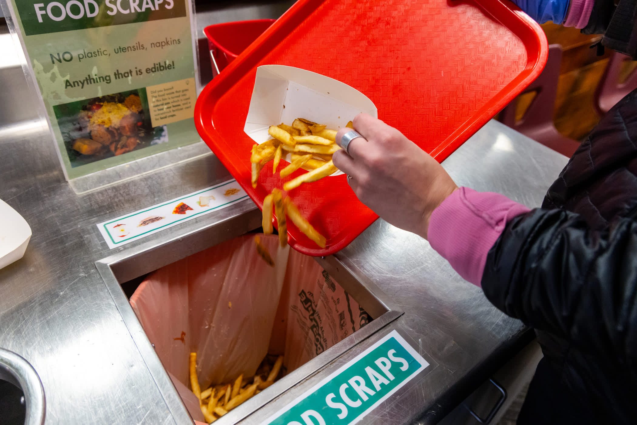 Throwing away food scraps at the Albion Grill 