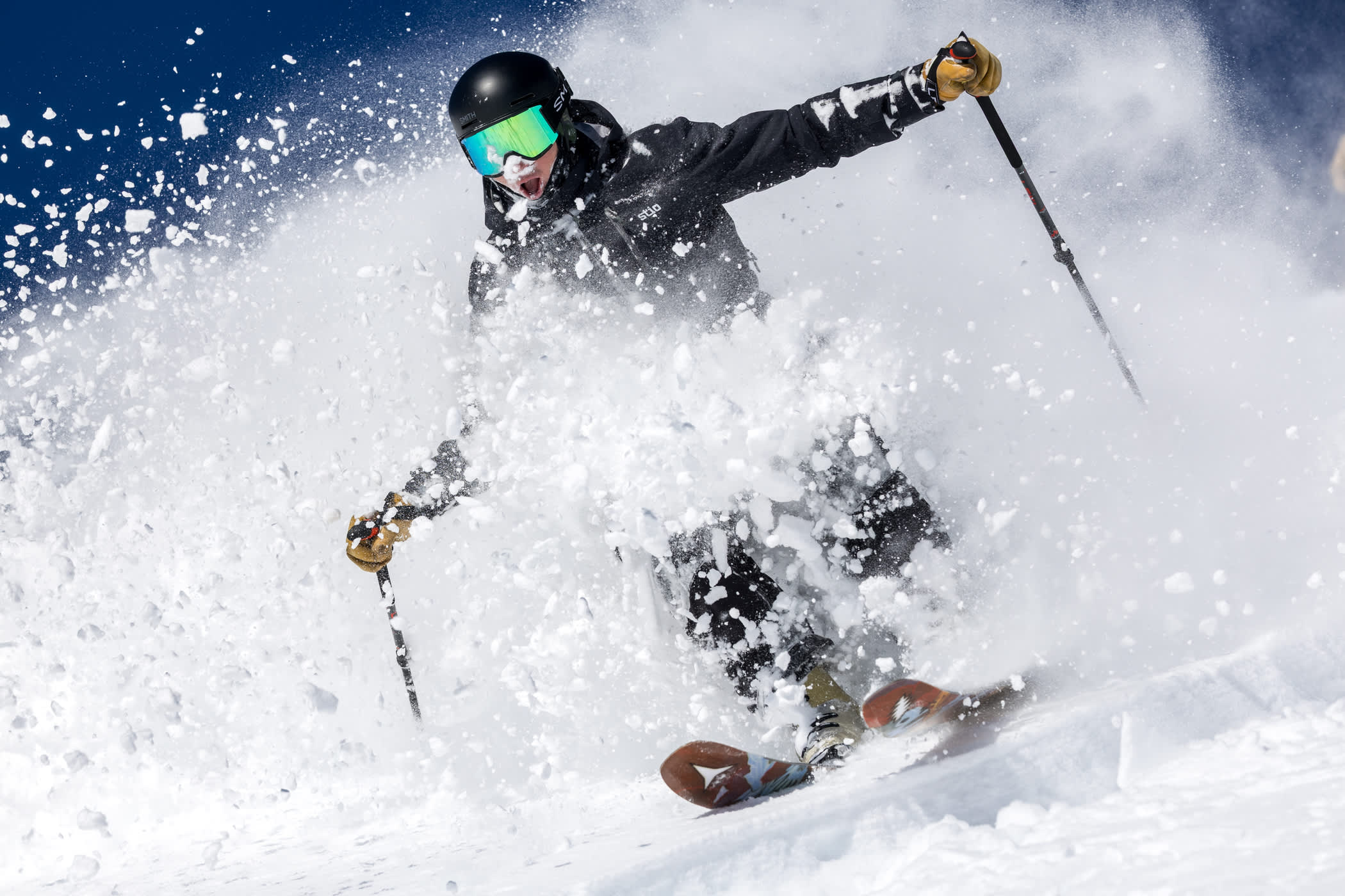 March 7th: An Alta skier catches a bluebird Backside rope drop | Photo: Photo-John