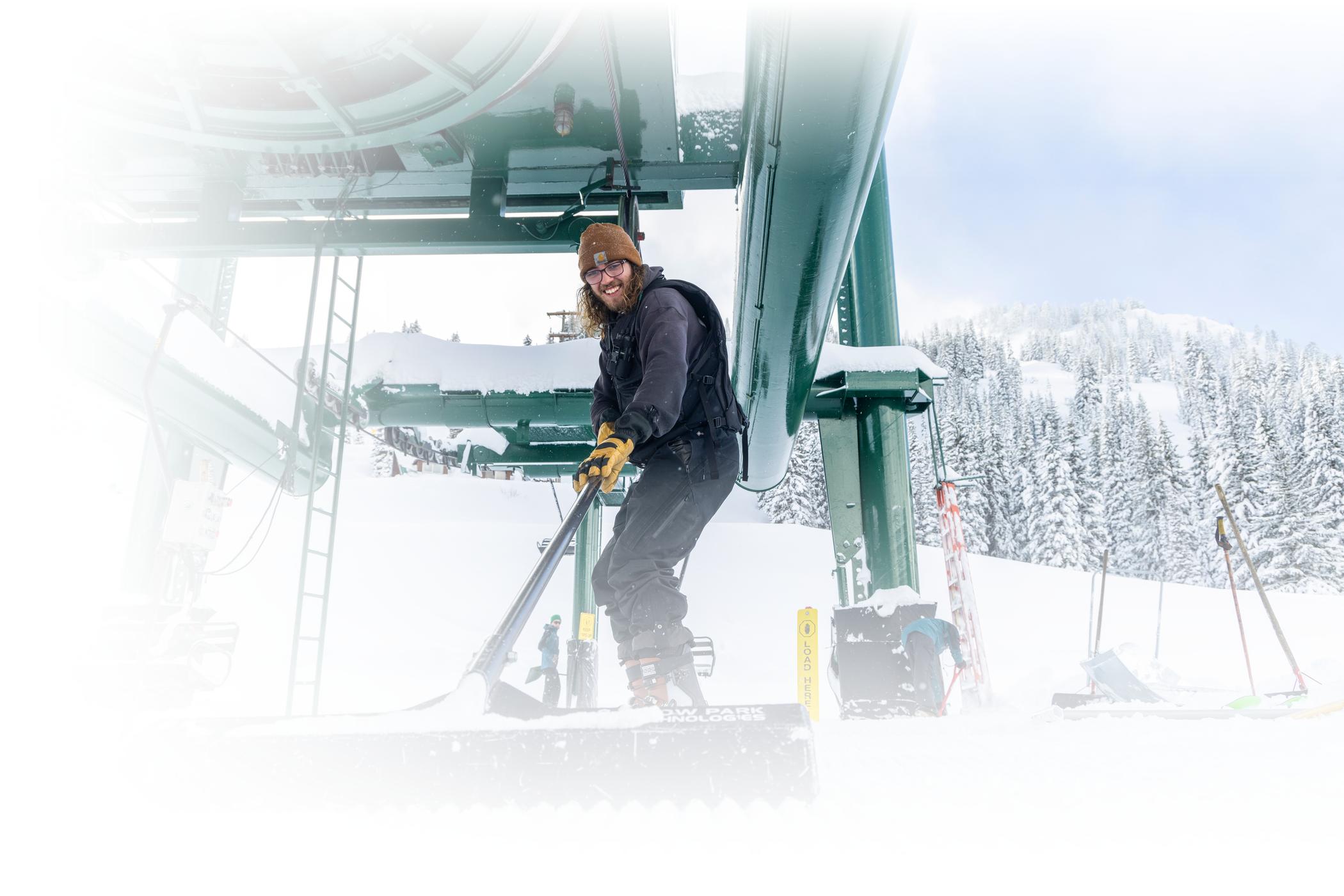 Lifties at Alta shovel snow