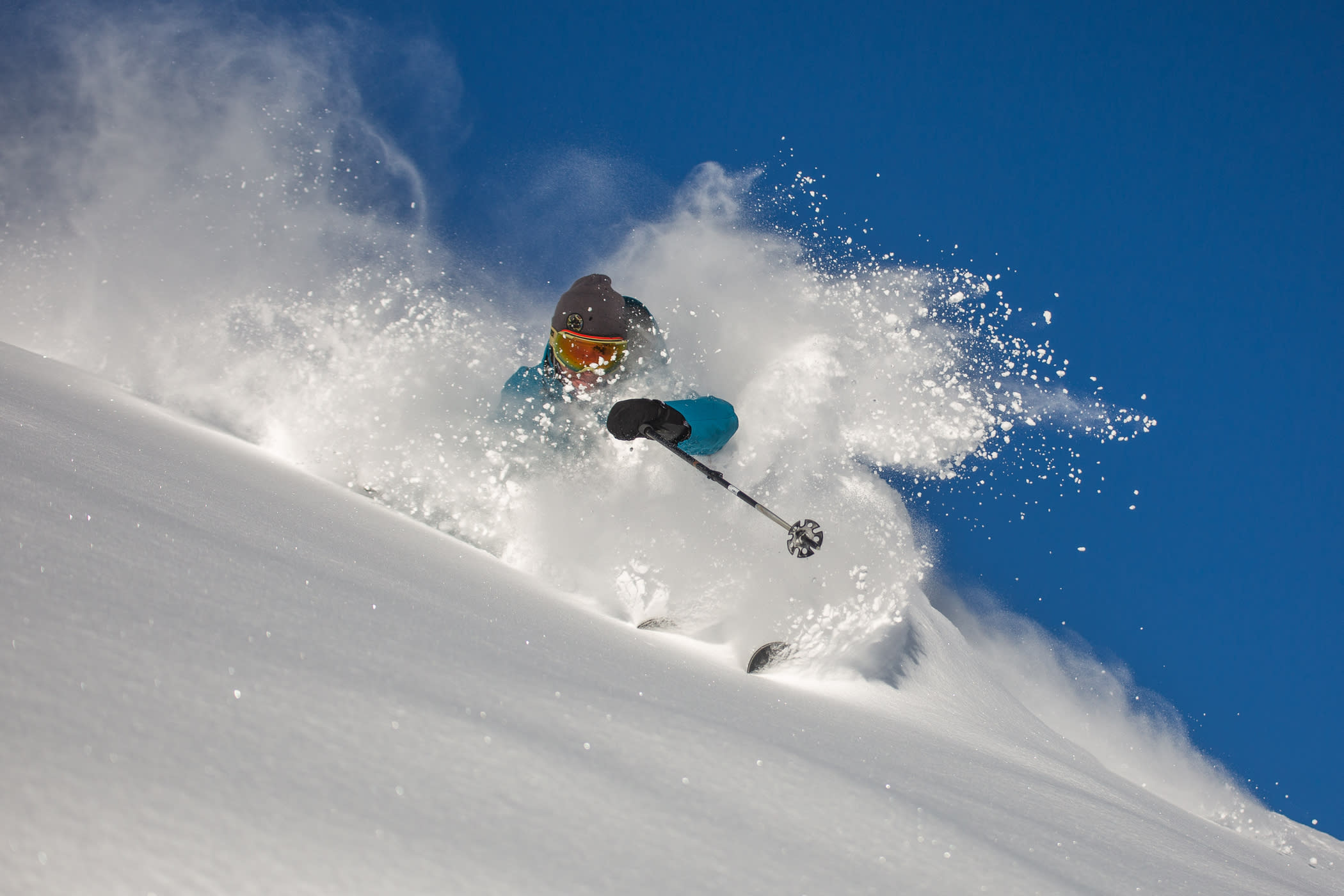 Dash Longe dives into a bluebird powder day in December Photo: Rocko Menzyk