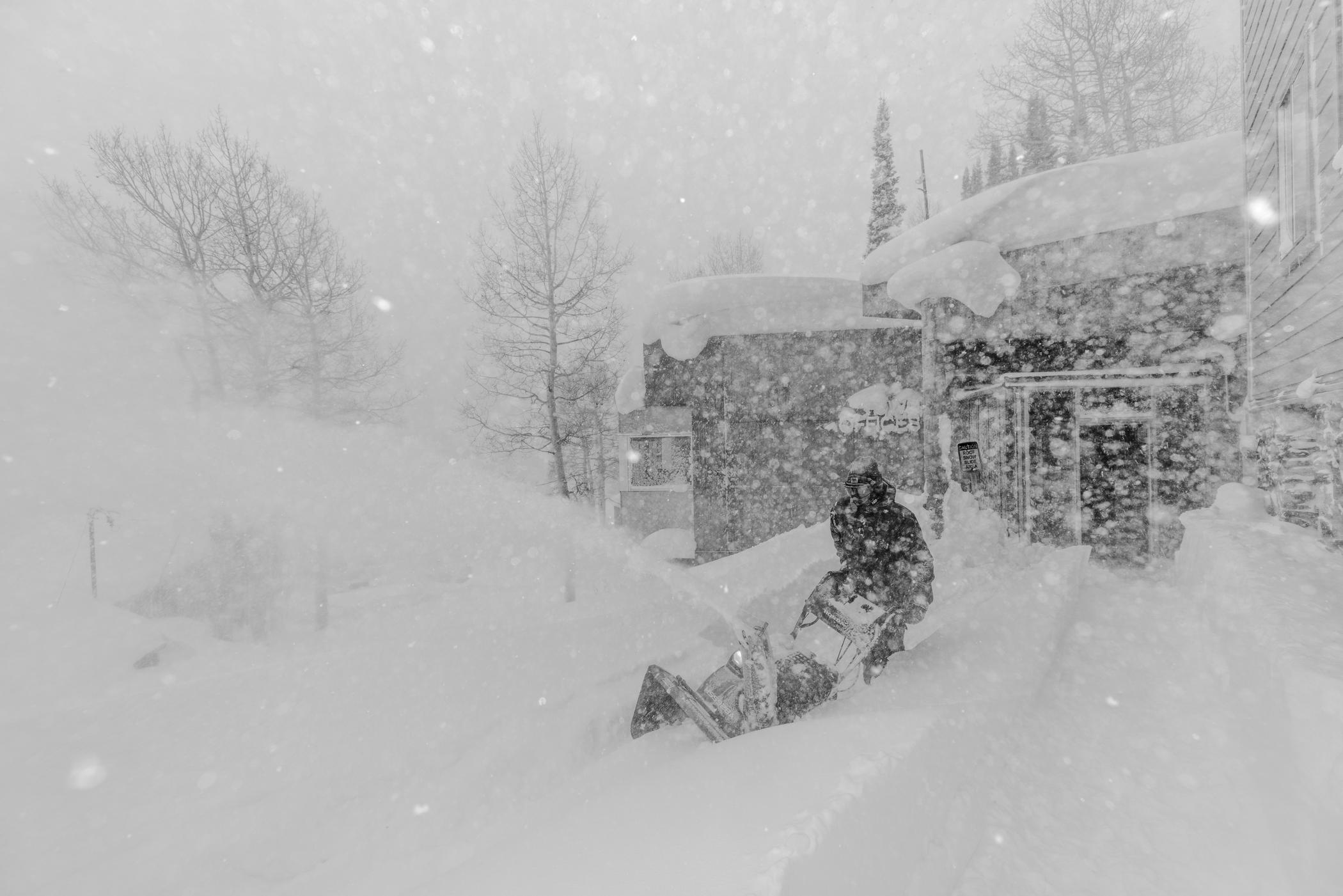 January 12th: Town of Alta employee Connor Worth clears snow in a snowstorm | Photo: Rocko Menzyk