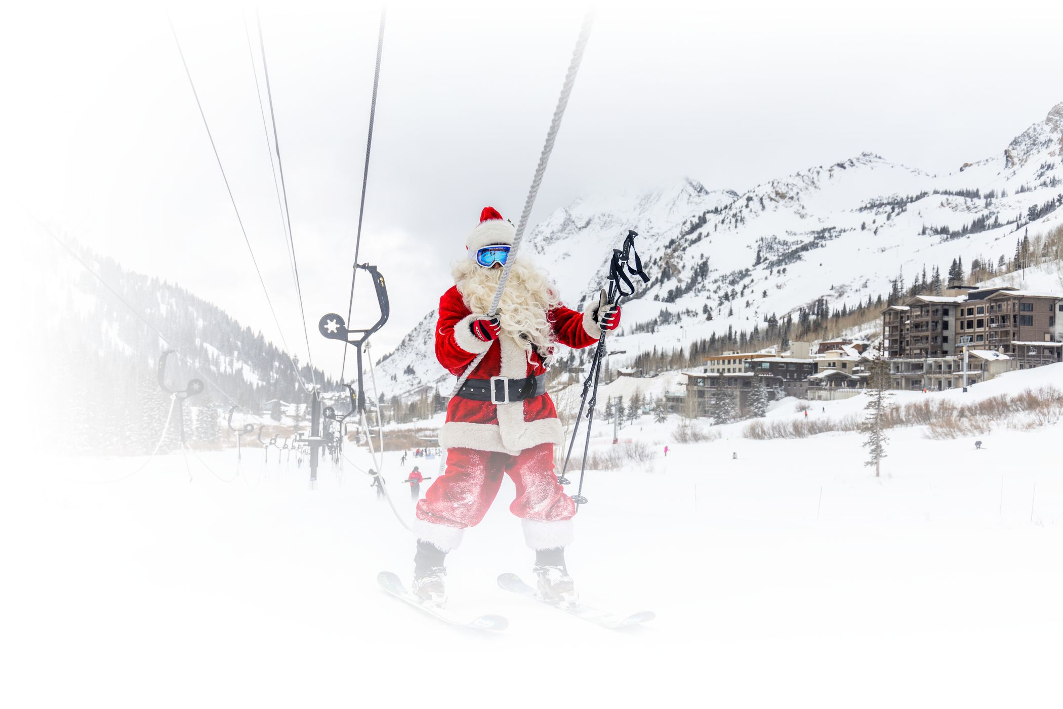 Santa waves at Alta skiers on a sunny day at Alta Ski Area