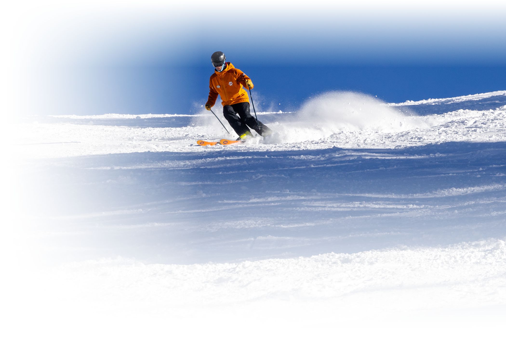 An Alf Engen Ski School instructor guides a skier down an intermediate run at Alta Ski Area