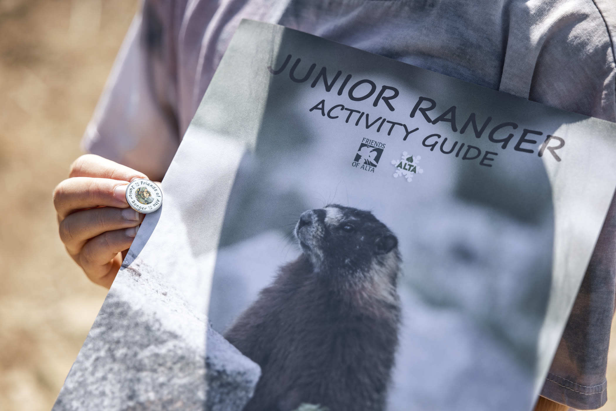 A Junior Ranger booklet and pin | Photo: Rocko Menzyk